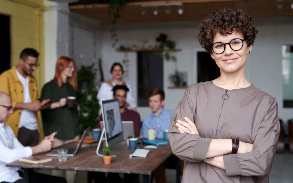An HR consultant at Bluewings Consultancy, with the recruitment team at work behind her