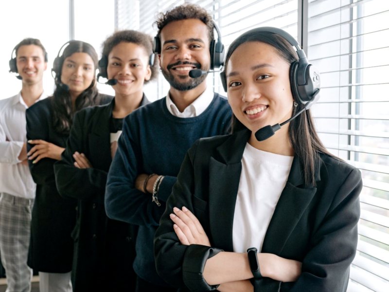 Customer support team wearing headsets