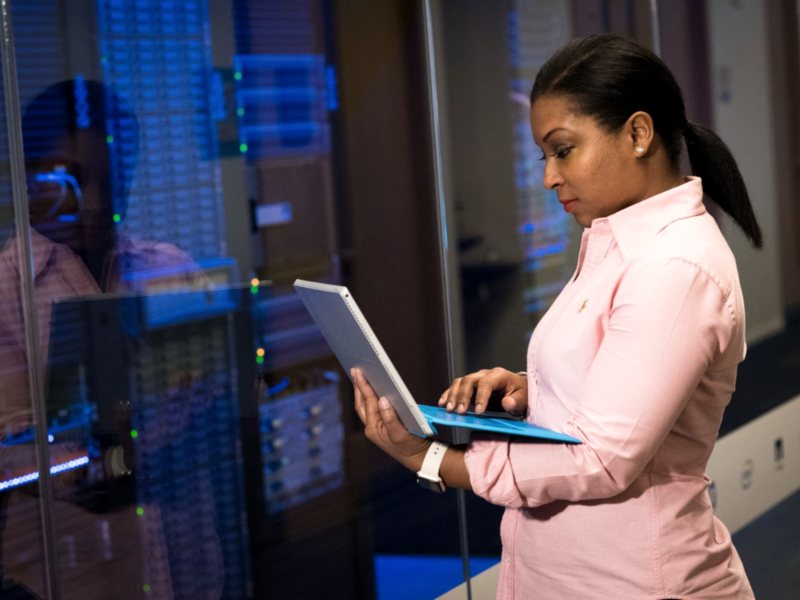 IT engineer reviewing systems in a data centre