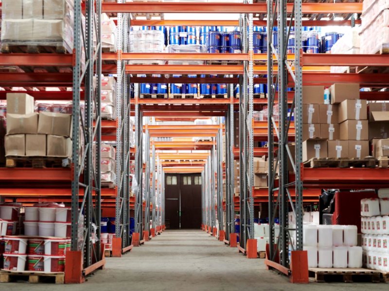 Warehouse aisle stacked with palletised goods
