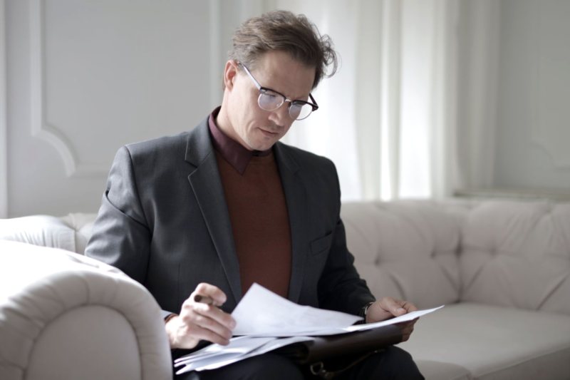 Compliance officer reviewing statutory records and returns